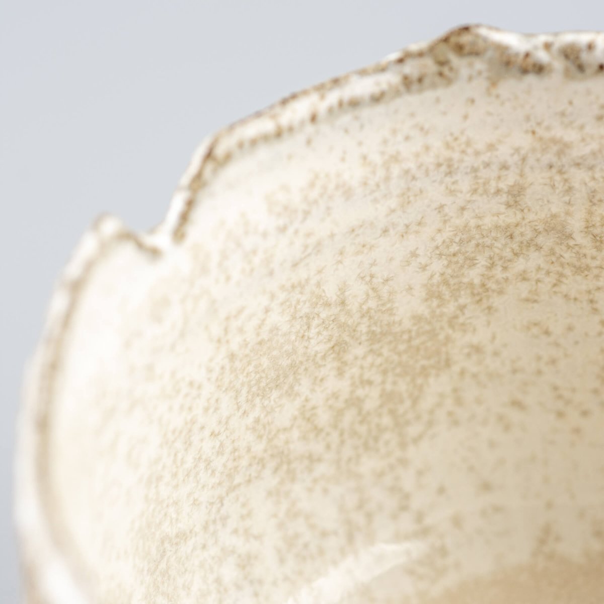 Interior glaze detail of handcrafted stoneware coffee cup, perfect for fine dining presentation.