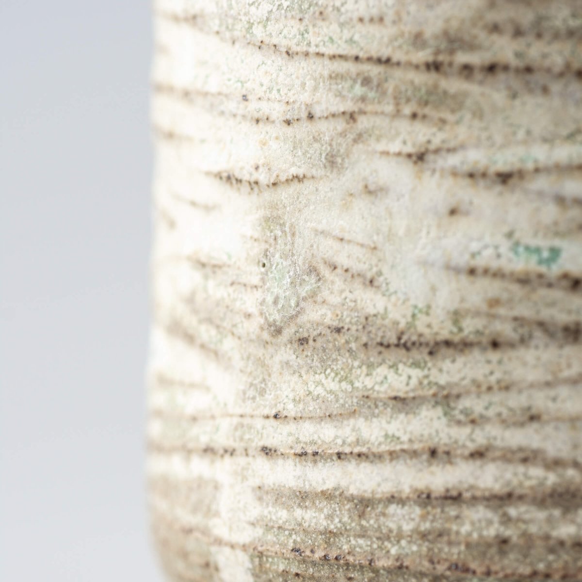 Handmade ceramic mug with textured stoneware surface and rustic glaze, perfect for home, fine dining, and gifts.