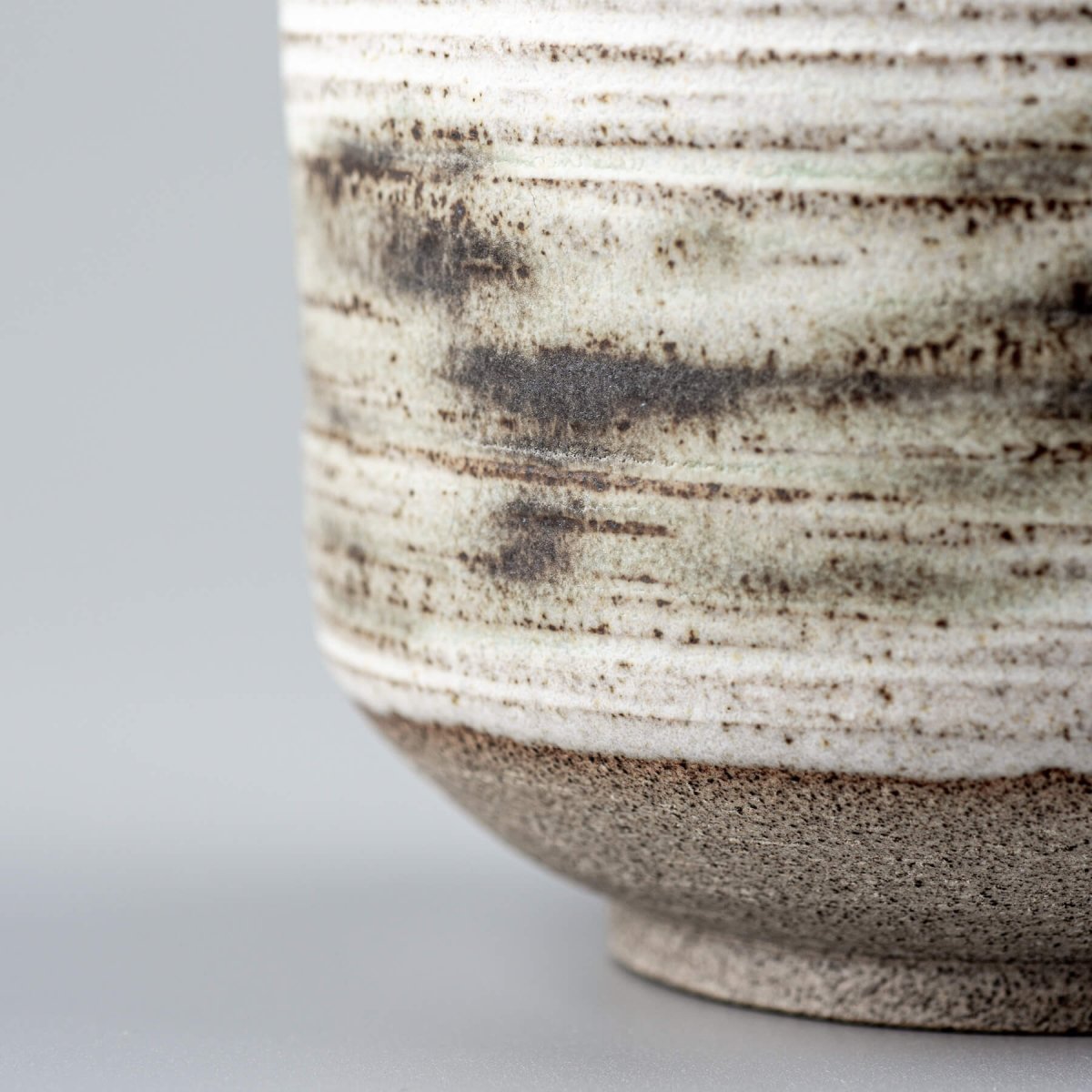 Handmade mugs with natural stoneware base, perfect for restaurants and collectors.