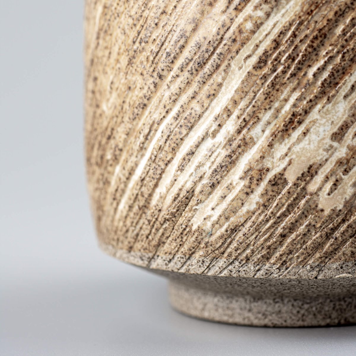 Textured handmade ceramic mugs with rustic matte glaze, crafted for everyday use and culinary presentation.