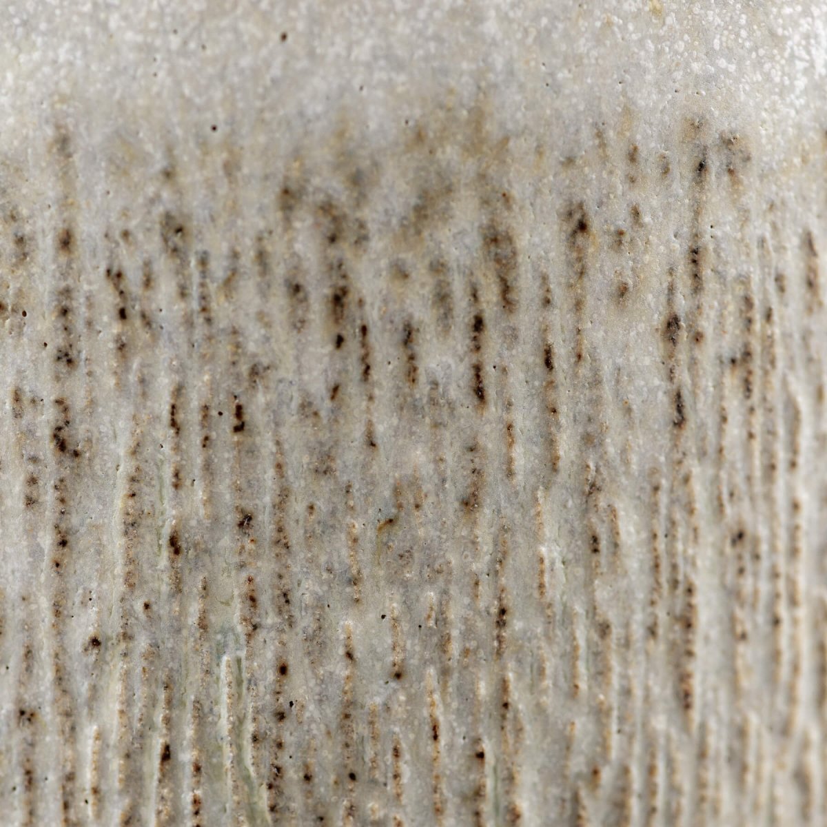 Rustic ceramic texture on handcrafted mugs, ideal for interior design and tableware.