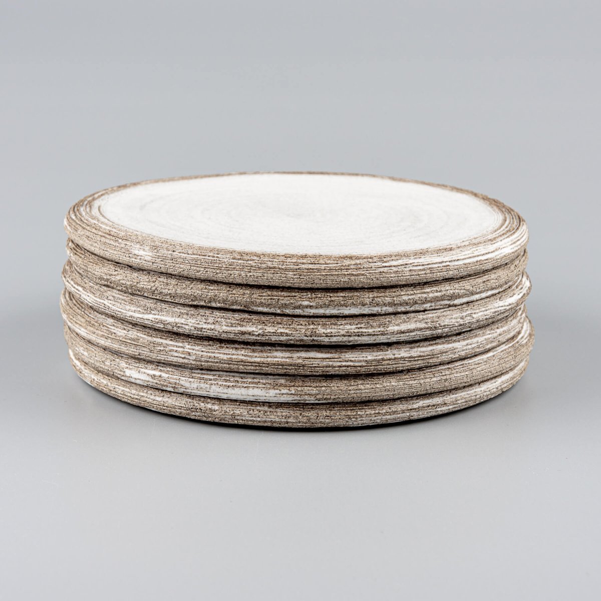 Stacked luxury ceramic plates designed for Michelin-star restaurants and fine dining.