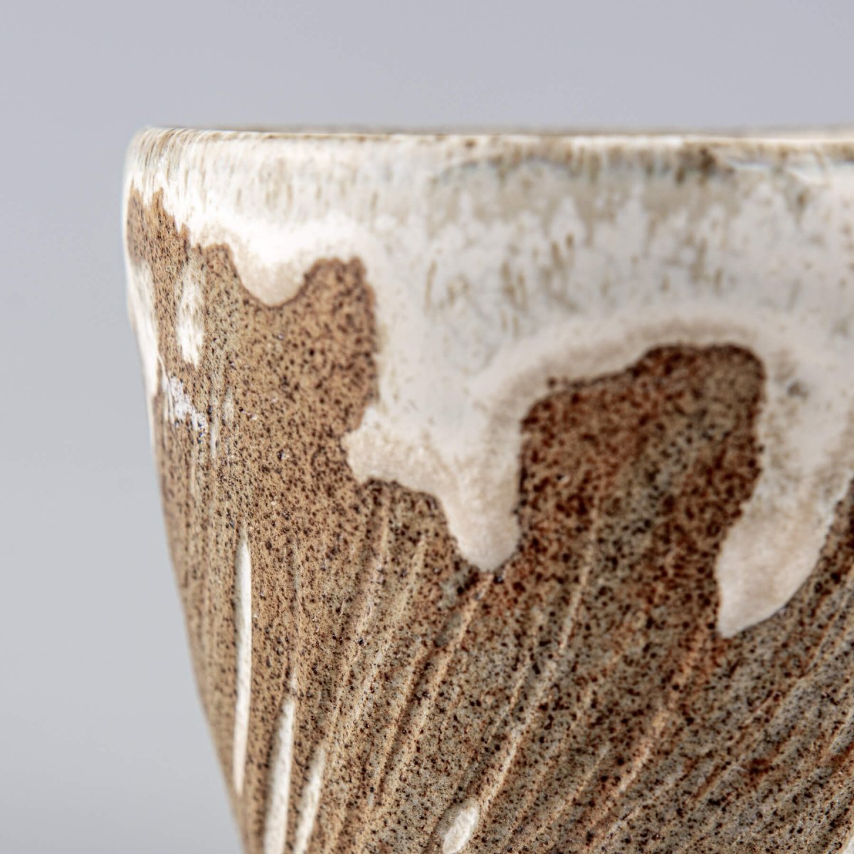 Handcrafted ceramic espresso mug with unique white glaze dripping effect.