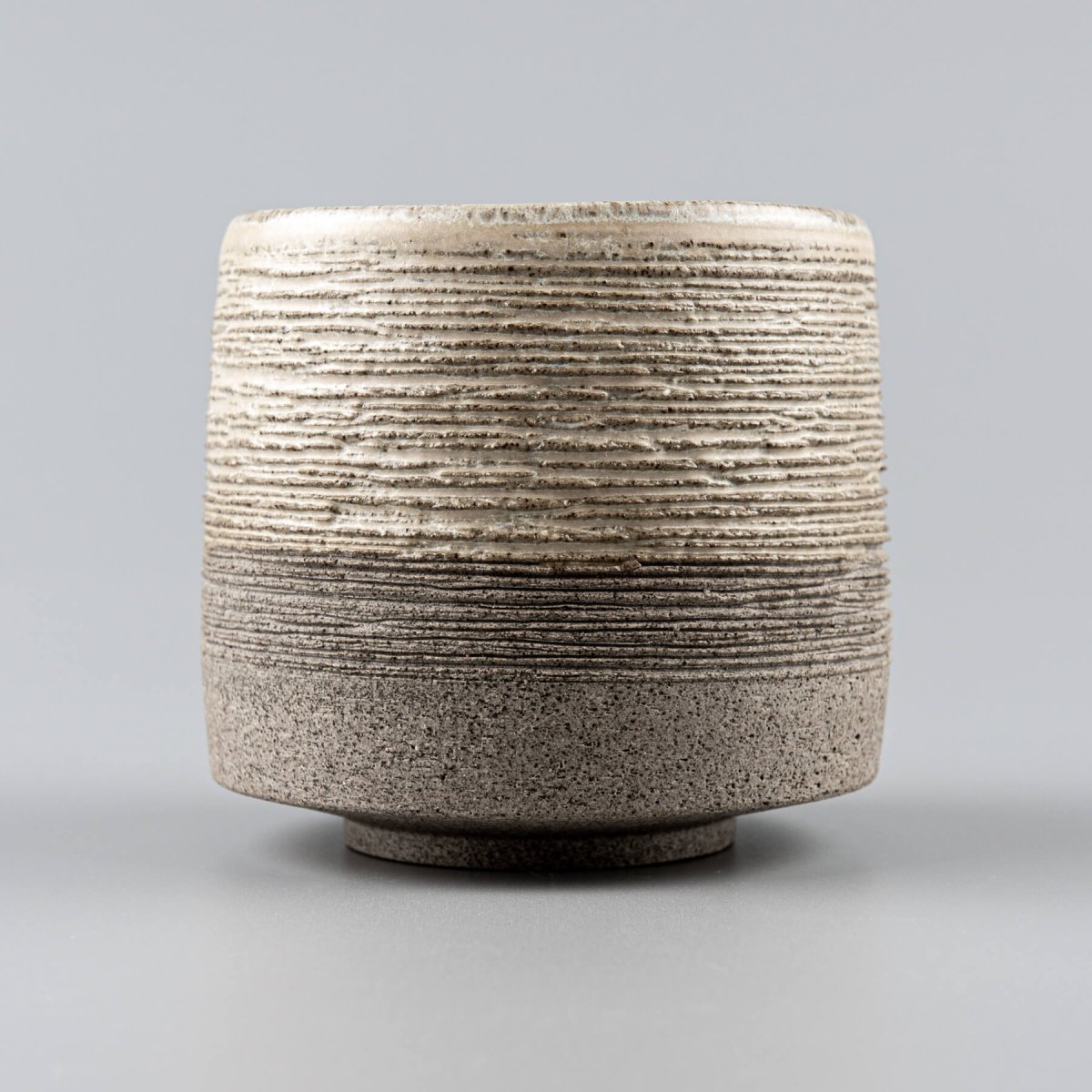 Interior view of handmade pottery coffee mug with smooth white matte glaze.