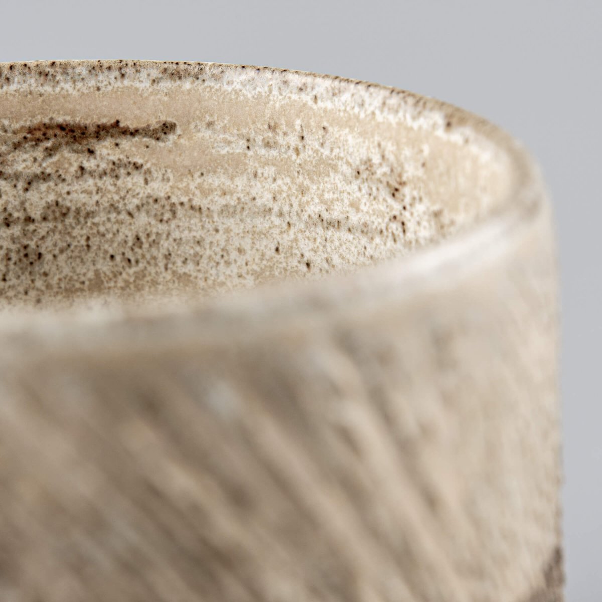 Artisan pottery coffee mugs with rustic carved finish, ideal for collectible pottery and tableware.