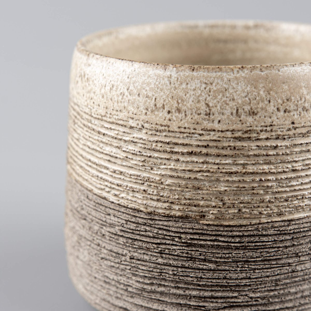 Elegant handmade pottery coffee mugs in neutral tones, perfect for interior design and gift ideas.
