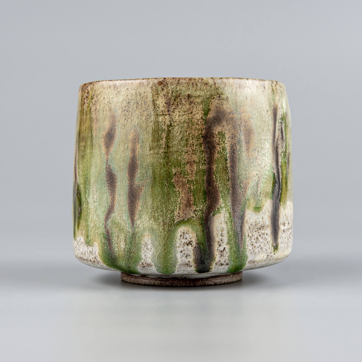 Handmade custom ceramic mugs with rustic stoneware texture and unique glaze finish.