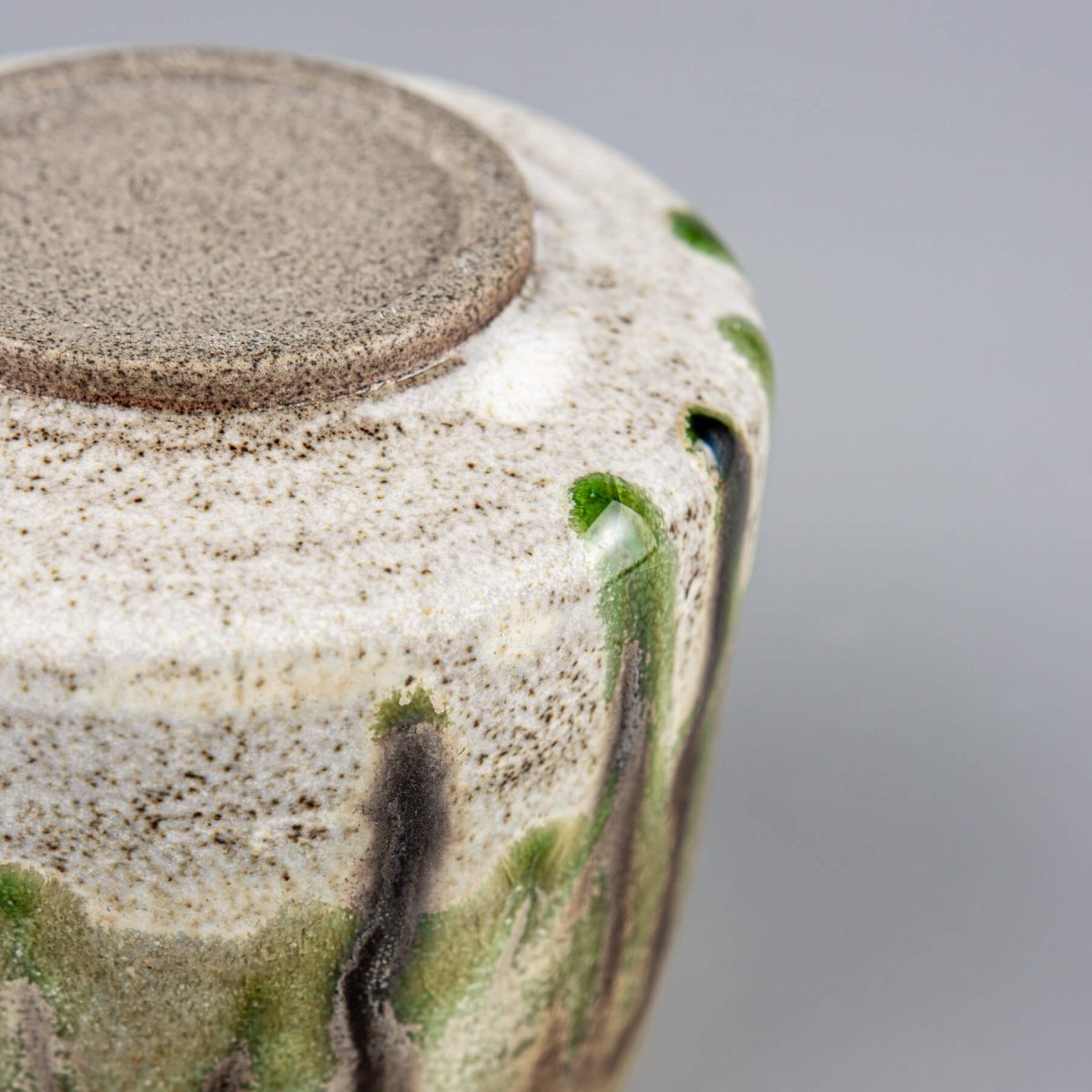 Unique handmade ceramic mug with layered glaze, ideal for design-focused interiors.