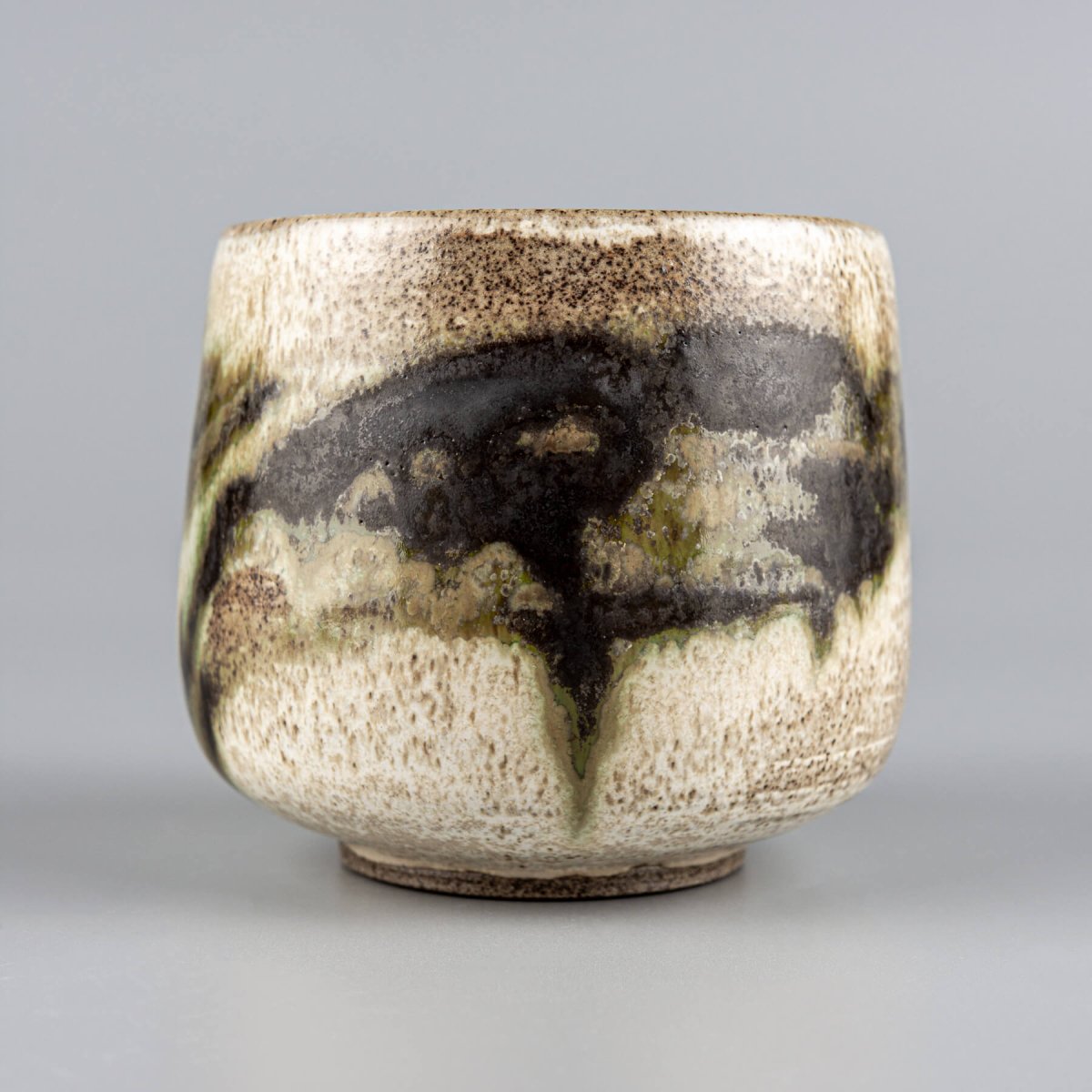 Handmade stoneware mug with unique layered glazes for coffee, tea, and cappuccino.