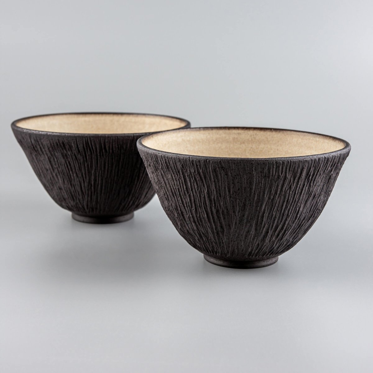 Two modern stoneware bowls side by side, perfect for boutique hotel or restaurant use.