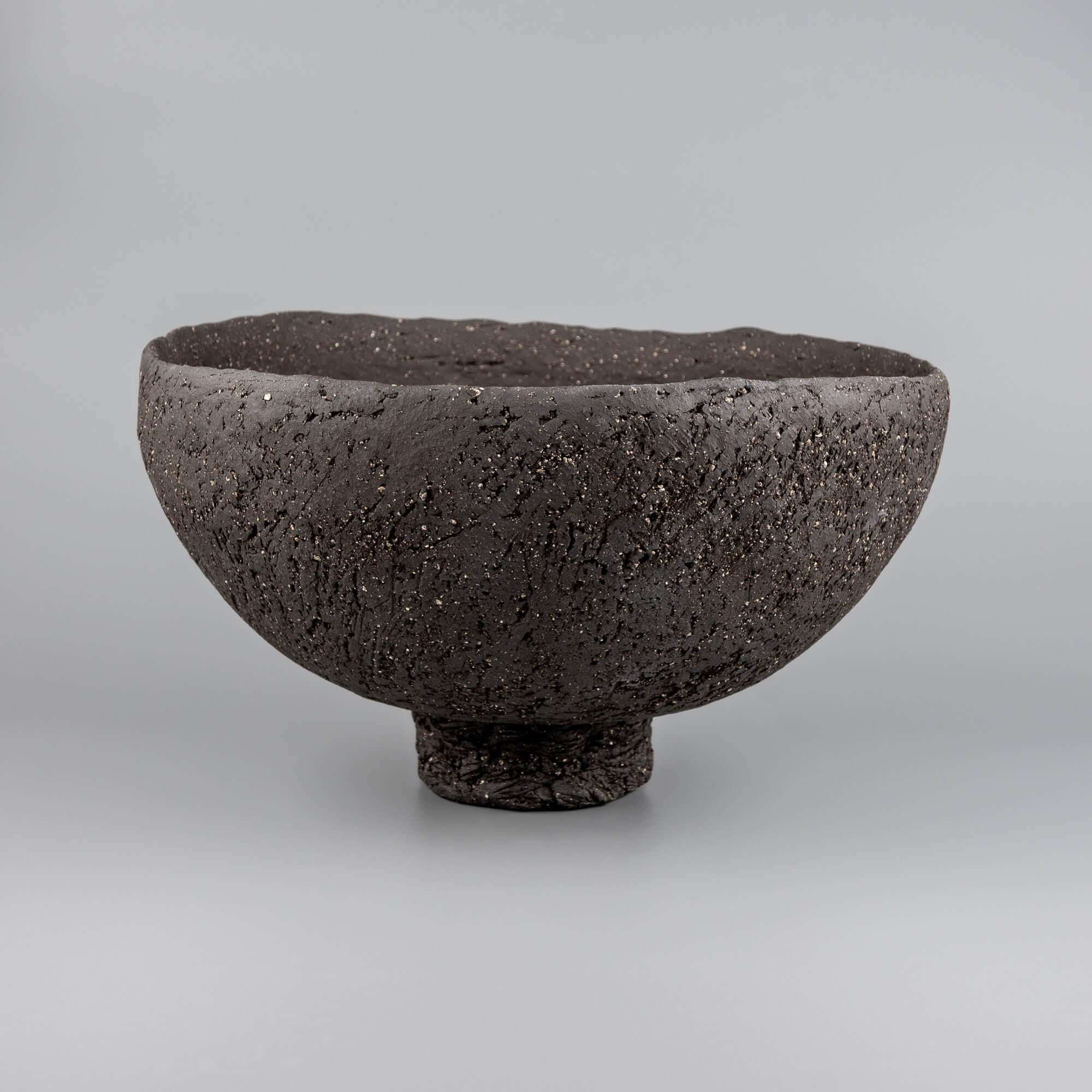 Handcrafted centerpiece bowl with volcanic texture for luxury homes, fine dining spaces, and interior design.